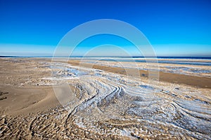 frozen sand textures in winter by the sea beach