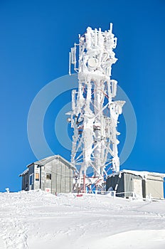 Frozen satellite antenna pole on top of Carpathian Mountains in Romania