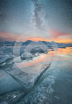 Frozen sea and night sky with stars