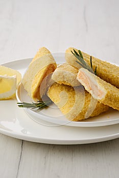 Frozen semifinished salmon patty in breading