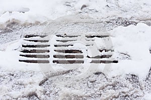 Frozen sewer grate in winter time