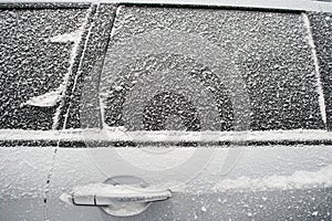 .Frozen side window of car