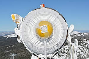 Frozen snow cannon, close up from behind