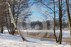 Frozen snow covered river in a winter landscape