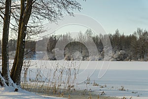 Frozen snow covered river in a winter landscape