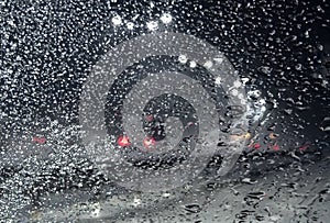 Frozen Snow On The Windshield Of Car On The Roadside At Night