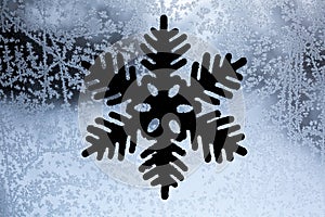 Frozen snowflakes pattern on window. Christmas decoration.