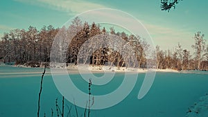 frozen and snowy forest pond in winter