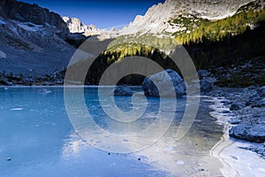 The frozen Sorapiss lake, Dolimiti mountains, Italy photo