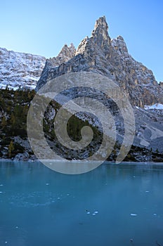 The frozen Sorapiss lake, Dolimiti mountains, Italy photo