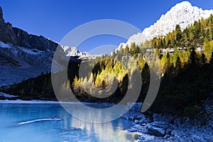 The frozen Sorapiss lake, Dolimiti mountains, Italy photo