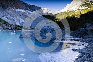 The frozen Sorapiss lake, Dolimiti mountains, Italy photo