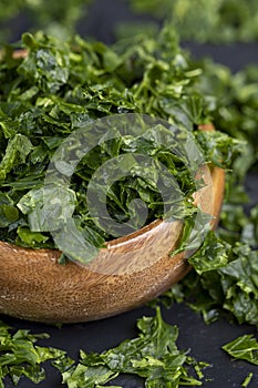 frozen for storing green spice parsley on the table photo