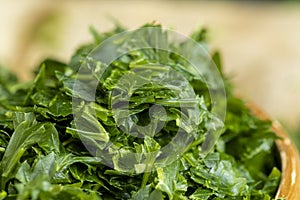 frozen for storing green spice parsley on the table photo