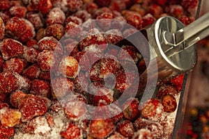 Frozen strawberries in a refrigerator in a supermarket. Ready-made semi-finished products for a healthy diet. Close-up. Top view