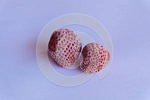 frozen strawberry with a white background