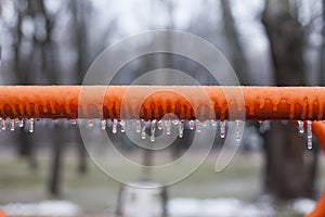 Frozen swing with icicles, playground, horizontal bars