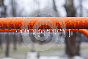 Frozen swing with icicles, playground, horizontal bars