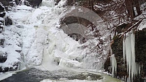 Frozen tiered waterfall covered in beautiful ice