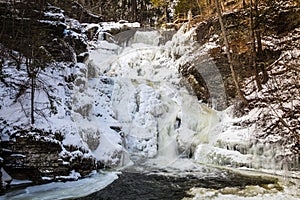 Frozen tiered waterfall covered in beautiful ice formations