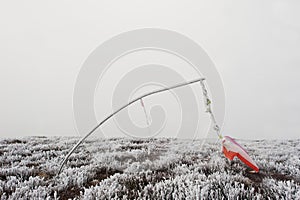 Frozen vane. Indicator of wind direction and flow forces at mountain