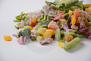 Frozen vegetable mixture of carrots, broccoli ,peppers, red onion and peas.