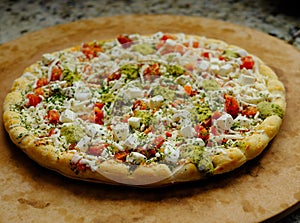 Frozen Vegetable Pizza on Cutting Board