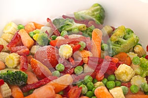 Frozen vegetables. Assorted , mix fresh vegetables. Cabbage green broccoli, orange carrots, red pepper, green peas, corn.ÃÂ¡oncept