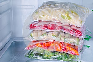Frozen vegetables in bags in refrigerator photo