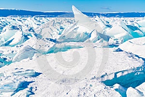 Frozen water covered with snow in Lake Baikal, Russia