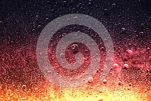 Frozen water drops red background