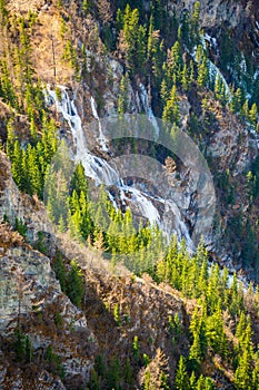 Frozen water in the waterfall in mountain of Altai Republic. Siberia, Russia