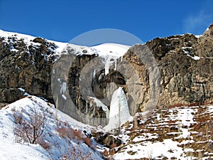 Frozen waterfall in Alborz mountains called Sangan Waterfall , winter landscape