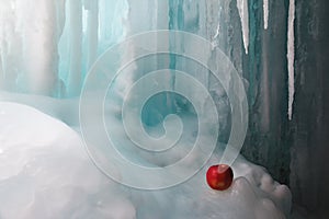 Frozen waterfall and apple