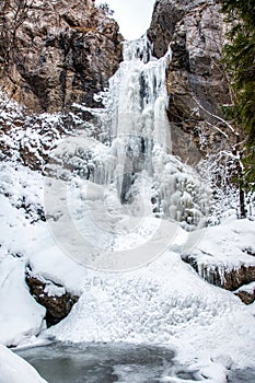 Frozen waterfall Cervene piseky in valley Prsiecka dolina in Slovakia