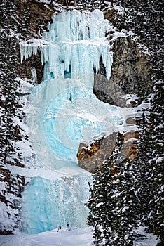 Frozen waterfall at the end of Lake Louise Canadian Winter Landscape