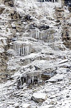 Frozen waterfall with ice on a cliff  winter landscape  Annapurna circuit  Nepal