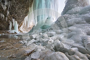 Frozen waterfall ice at Siklava skala rock at Volovske vrchy during winter