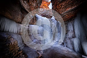 Frozen waterfall in mountain gorge