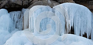 Frozen waterfall with opaque blue ice