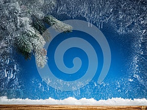 Frozen window and Christmas tree.