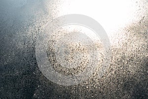 Frozen window, ice on glass, sunlight in winter, texture