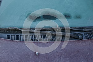 Frozen windscreen and windshield wipers totally covered with ice, caution, poor view causes dangerous driving