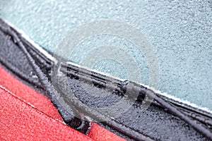 Frozen windscreen and wipers of a car