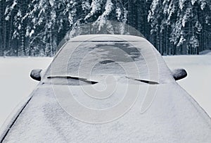 Frozen winter car covered snow, view front window windshield