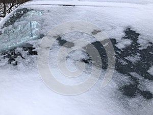 Frozen winter car covered snow, view front window windshield on snowy background