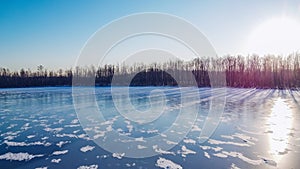 Frozen winter lake ice. Beautiful clear blue ice stock photo. Selective focus, blurred background