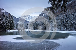 Frozen winter lake in the mountains