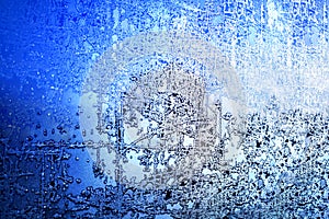 Frozen winter window, glass with frosty patterns, hoarfrost texture, snowflakes, New Year or Christmas ornament for banner, border