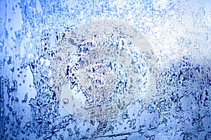 Frozen winter window, glass with frosty patterns, hoarfrost texture, snowflakes, New Year or Christmas ornament for banner, border